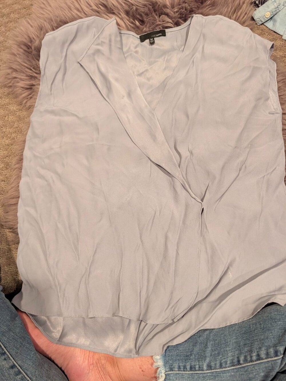 Silky asymmetrical flap front blouse .